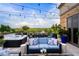Expansive rooftop patio with a hot tub, dining area, and comfortable blue seating at 3286 Northside Nw Pkwy # Ph2, Atlanta, GA 30327