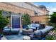Relaxing rooftop patio featuring stylish seating, a water feature, and lush greenery at 3286 Northside Nw Pkwy # Ph2, Atlanta, GA 30327