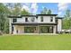Expansive backyard featuring a covered patio area and large sliding glass doors at 4125 Ashwoody Ne Trl, Brookhaven, GA 30319