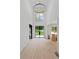Grand foyer with soaring ceilings, a modern chandelier, and a double-door entry at 4125 Ashwoody Ne Trl, Brookhaven, GA 30319
