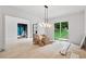 Bright and airy living room with a modern chandelier and access to the backyard at 4125 Ashwoody Ne Trl, Brookhaven, GA 30319