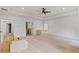 Large bedroom with tray ceiling, multiple windows, and doorways leading to other rooms at 4125 Ashwoody Ne Trl, Brookhaven, GA 30319