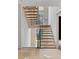 Modern staircase with metal railings and stone accent wall detail at 4125 Ashwoody Ne Trl, Brookhaven, GA 30319