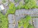Aerial view showcases meticulously maintained community, surrounded by mature trees and convenient parking at 4222 Rickenbacker Ne Dr # 9, Atlanta, GA 30342