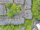 Aerial view showcases a well-maintained community with parking, green spaces, mature trees, and manicured landscaping at 4222 Rickenbacker Ne Dr # 9, Atlanta, GA 30342