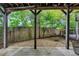 Back patio, showcasing a private fenced backyard with gravel and some shade at 4222 Rickenbacker Ne Dr # 9, Atlanta, GA 30342