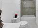 A bathroom featuring a modern toilet, bathtub with shower and grey tile at 4222 Rickenbacker Ne Dr # 9, Atlanta, GA 30342