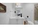 Clean bathroom featuring a white vanity, toilet, decorative accents, and tiled shower at 4222 Rickenbacker Ne Dr # 9, Atlanta, GA 30342