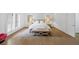 Inviting bedroom with plantation shutters, hardwood floors, and neutral tones creating a relaxing retreat at 4222 Rickenbacker Ne Dr # 9, Atlanta, GA 30342