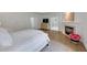 Luxurious bedroom featuring a fireplace, hardwood floors, and an en-suite bathroom for added convenience at 4222 Rickenbacker Ne Dr # 9, Atlanta, GA 30342