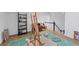 Bonus room featuring hardwood floors, artist's easel, shelving, and comfortable seating at 4222 Rickenbacker Ne Dr # 9, Atlanta, GA 30342
