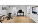 Bonus room with wood flooring, a sliding barn door to bathroom, and view to office at 4222 Rickenbacker Ne Dr # 9, Atlanta, GA 30342