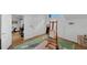Bright bonus room featuring white walls, wood floors, and an artist's easel at 4222 Rickenbacker Ne Dr # 9, Atlanta, GA 30342