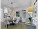 Cozy dining room with hardwood floors, plantation shutters, and stylish furniture at 4222 Rickenbacker Ne Dr # 9, Atlanta, GA 30342