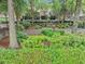 Landscaped community green space with mature trees, foliage, and stone walls at 4222 Rickenbacker Ne Dr # 9, Atlanta, GA 30342