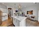 Open concept kitchen with large island with stainless steel appliances and hardwood flooring at 4222 Rickenbacker Ne Dr # 9, Atlanta, GA 30342