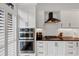 Modern kitchen with stainless steel appliances, black countertops, and white cabinetry at 4222 Rickenbacker Ne Dr # 9, Atlanta, GA 30342