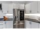 Kitchen featuring stainless steel refrigerator, white cabinetry, and stylish black countertops at 4222 Rickenbacker Ne Dr # 9, Atlanta, GA 30342