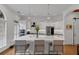 Modern kitchen with white cabinets, a large island, and stainless steel appliances at 4222 Rickenbacker Ne Dr # 9, Atlanta, GA 30342