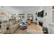 Airy living room featuring a fireplace, large windows, neutral decor, and stylish furniture at 4222 Rickenbacker Ne Dr # 9, Atlanta, GA 30342