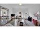 Stylish living area with a work space, sofa, large mirror, and plenty of natural light at 4222 Rickenbacker Ne Dr # 9, Atlanta, GA 30342