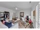 Well-lit living space with a closet, desk, large mirror, sofa and neutral decor at 4222 Rickenbacker Ne Dr # 9, Atlanta, GA 30342
