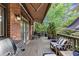 Inviting deck with awning, brick exterior, grill, and comfortable outdoor seating area at 4222 Rickenbacker Ne Dr # 9, Atlanta, GA 30342