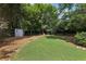 Spacious backyard with a shed and an outdoor fire pit area at 4620 Springdale Ct, Cumming, GA 30041