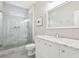 Bright bathroom featuring a marble vanity, glass shower, and modern fixtures at 4620 Springdale Ct, Cumming, GA 30041