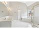 Spacious bathroom with a soaking tub, stand-up shower and double vanity at 4620 Springdale Ct, Cumming, GA 30041