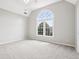 Spacious bedroom featuring neutral colors, plush carpeting and large window at 4620 Springdale Ct, Cumming, GA 30041