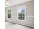 Bright bedroom features neutral paint, plush carpet, and double hung windows at 4620 Springdale Ct, Cumming, GA 30041