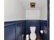 Well-maintained bathroom with painted wainscoting and neutral finishes at 2 Arpege Nw Way, Atlanta, GA 30327
