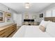 This bedroom features a desk and a bed with a white comforter and a decorative pillow at 2 Arpege Nw Way, Atlanta, GA 30327