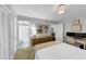 This bedroom features a desk and a bed with a white comforter and a decorative pillow at 2 Arpege Nw Way, Atlanta, GA 30327