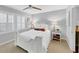 Inviting bedroom with white furniture, comfortable bedding, and a ceiling fan at 2 Arpege Nw Way, Atlanta, GA 30327