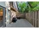 The deck features a grill and wooden fence, perfect for outdoor living and entertaining at 2 Arpege Nw Way, Atlanta, GA 30327