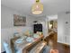 Charming dining room with hardwood floors, decorous painting and an adjoining room at 2 Arpege Nw Way, Atlanta, GA 30327