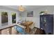 Cozy dining area with a wooden table, bench seating, and a decorative blue cabinet at 2 Arpege Nw Way, Atlanta, GA 30327