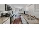 Modern kitchen with black appliances and seamless access to the dining area at 2 Arpege Nw Way, Atlanta, GA 30327