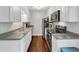 Well-maintained kitchen with stainless steel appliances and granite countertops at 2 Arpege Nw Way, Atlanta, GA 30327