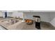 Kitchen area with stainless steel sink, gray countertops, and modern appliances at 2 Arpege Nw Way, Atlanta, GA 30327