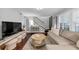 Living room featuring hardwood floors, staircase, modern furniture, and decor at 2 Arpege Nw Way, Atlanta, GA 30327