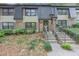 Charming townhouse with a welcoming entrance and a neatly maintained front yard at 2 Arpege Nw Way, Atlanta, GA 30327