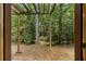 View from the back porch highlights the backyard and surrounding mature trees at 3323 Silver Ridge Ct, Duluth, GA 30096