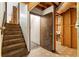 Basement area with stairs, open door, and utilitarian features, perfect for storage or customization at 3323 Silver Ridge Ct, Duluth, GA 30096