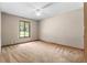 Neutral bedroom featuring a single window, neutral walls, and carpet flooring at 3323 Silver Ridge Ct, Duluth, GA 30096