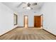 Spacious bedroom with two doors, a window, and carpet floors, ready for decor at 3323 Silver Ridge Ct, Duluth, GA 30096