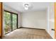 Bright bedroom with sliding glass door to the outside and neutral carpet at 3323 Silver Ridge Ct, Duluth, GA 30096