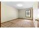 Neutral bedroom featuring a single window, neutral walls, and carpet flooring at 3323 Silver Ridge Ct, Duluth, GA 30096